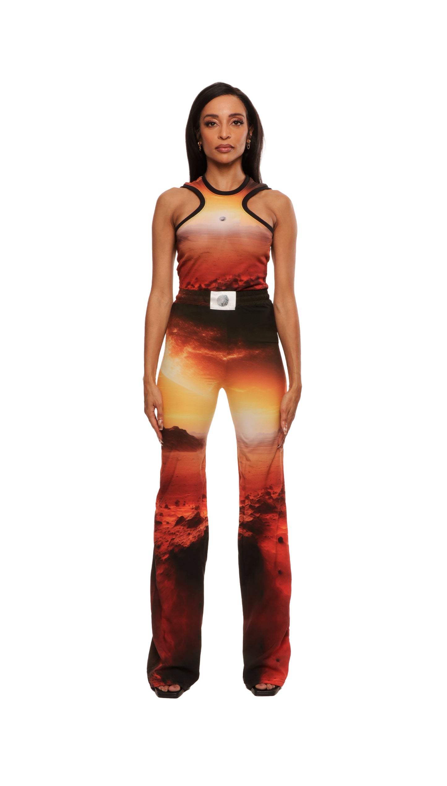 Woman who looks like Beyoncé or Aaliyah wears cosmic Mars sunset printed wide leg pant, front view 