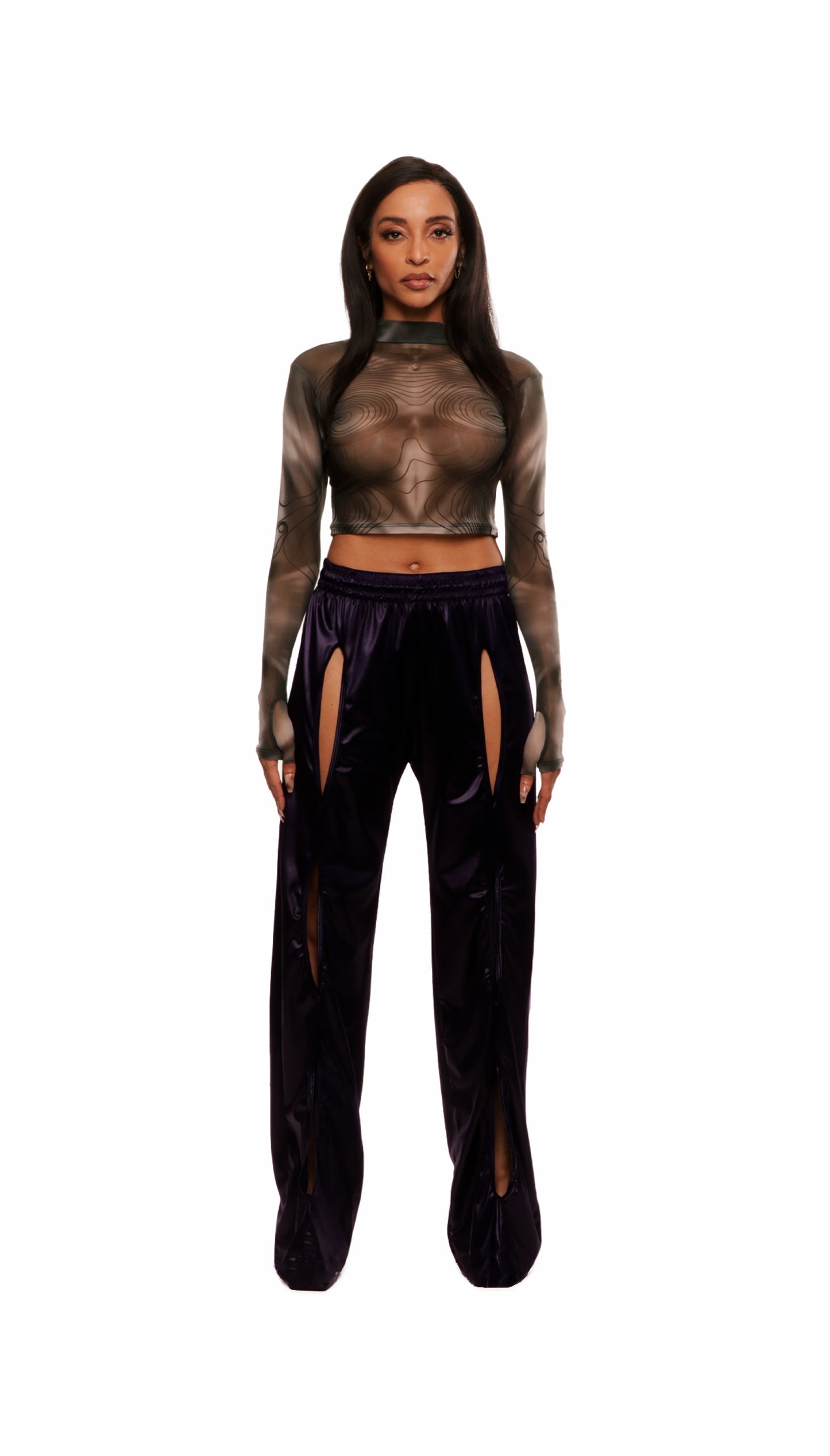 Woman who looks like Beyoncé or Aaliyah wears berry colored stretch smooth nylon pants with open detail front, paired with a grey stretch mesh long sleeve shirt top. Front view.